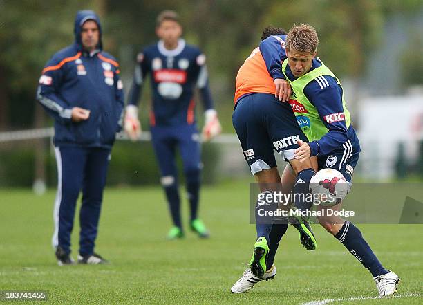 Guilherme Finkler and Adrian Leijer contest for the ball during a Melbourne Victory A-League training session at Gosch's Paddock on October 10, 2013...