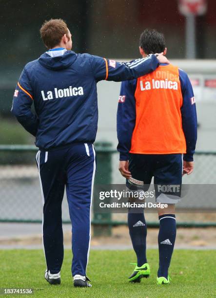 Guilherme Finkler walks from the ground after getting his knee checked after a contest with Adrian Leijer during a Melbourne Victory A-League...