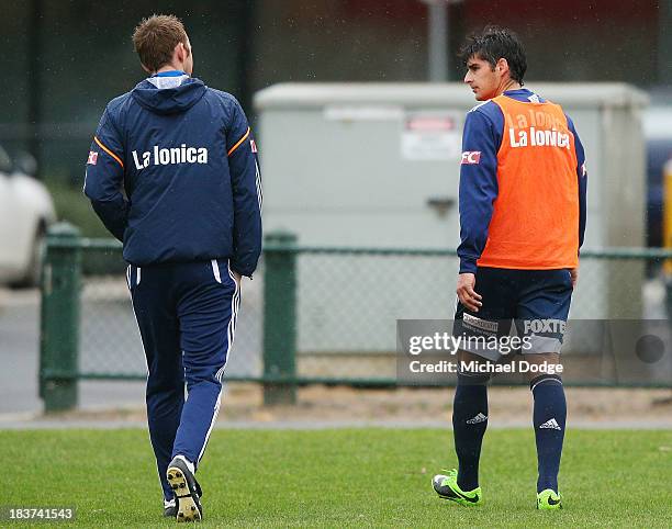 Guilherme Finkler walks from the ground after getting his knee checked after a contest with Adrian Leijer during a Melbourne Victory A-League...