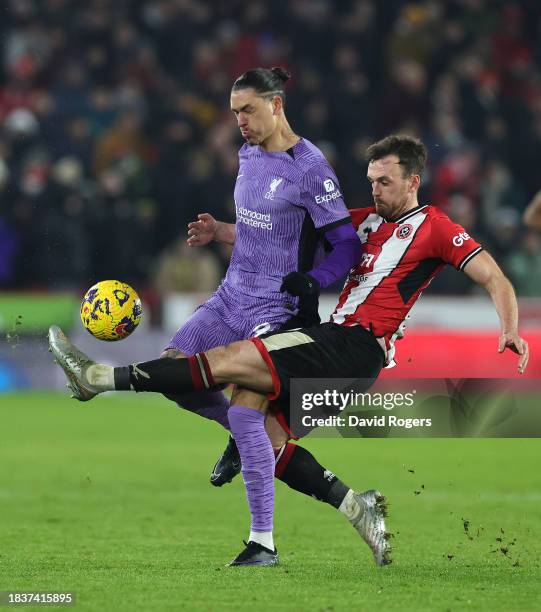 Darwin Nunez of Liverpool is tackled by Jack Robinson during the Premier League match between Sheffield United and Liverpool FC at Bramall Lane on...