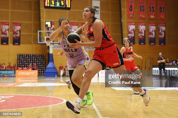 Emily Potter of the Lynx drives to the basket during the WNBL match between Perth Lynx and Melbourne Boomers at Bendat Basketball Stadium, on...
