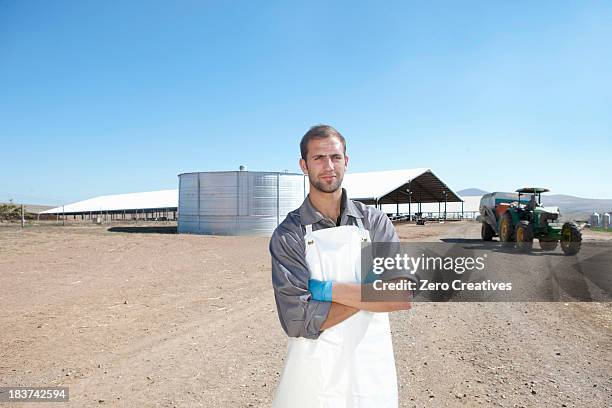 portrait of worker on dairy farm - farmer confident serious stock pictures, royalty-free photos & images