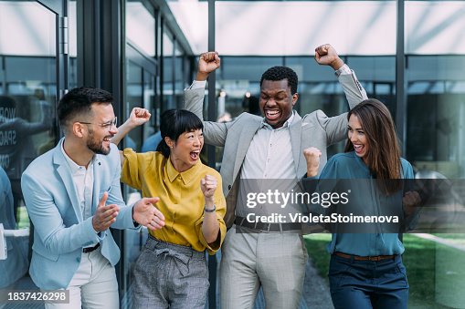 Cheerful entrepreneurs celebrating success in the office. Cheerful entrepreneurs celebrating success in the office.