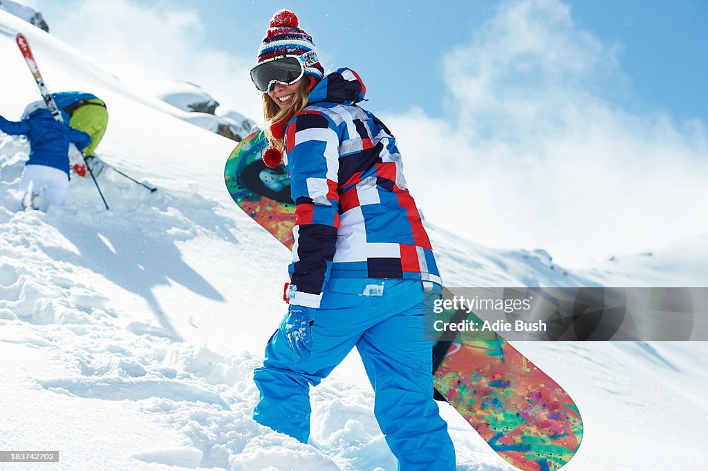 Female snowboarder in snow