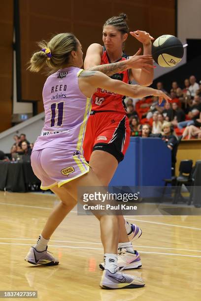 Tera Reed of the Boomers strips the ball from Emily Potter of the Lynx during the WNBL match between Perth Lynx and Melbourne Boomers at Bendat...