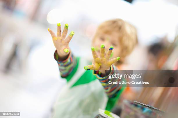 boy with paint on his hands - art studio stock pictures, royalty-free photos & images