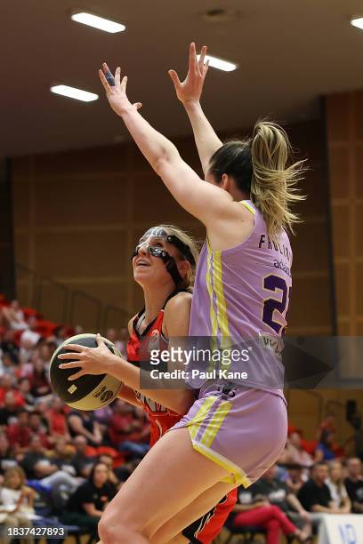 Miela Goodchild of the Lynx goes to the basket against Keely Froling of the Boomers during the WNBL match between Perth Lynx and Melbourne Boomers at...
