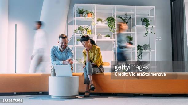 business partners on meeting in the office. - business man woman walking stock pictures, royalty-free photos & images