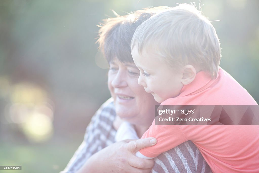 Boy hugging grandmother