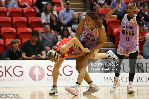 Miela Goodchild of the Lynx and Naz Hillmon of the Boomers contest for the ball during the WNBL match between Perth Lynx and Melbourne Boomers at...