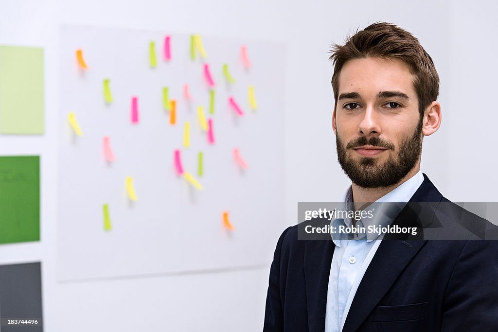 Portrait of young man in design studio