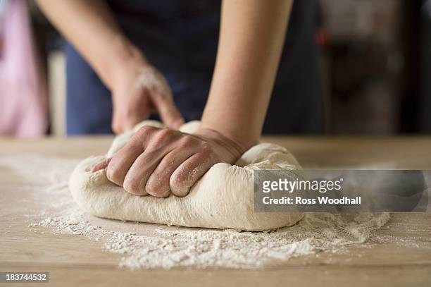 hands kneading bread dough - action cooking stock pictures, royalty-free photos & images