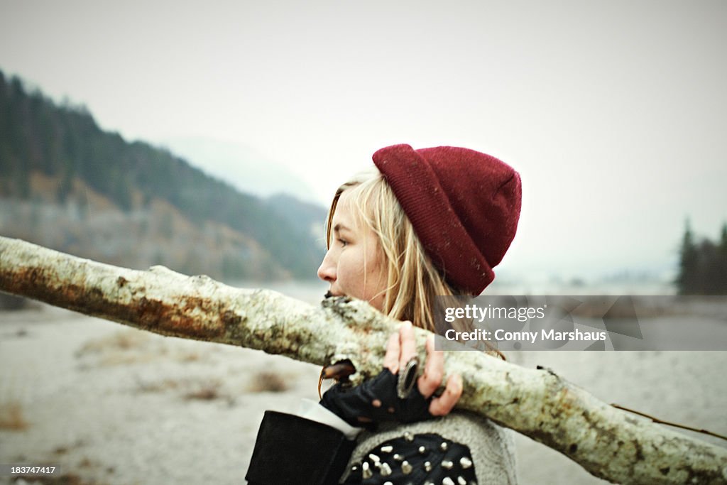 Woman holding log