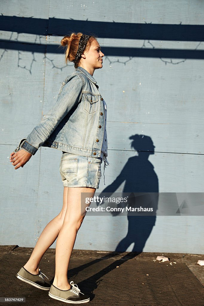 Side view of woman and shadow