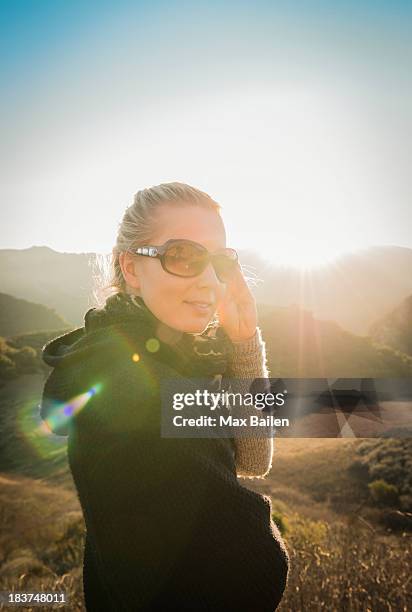 woman standing in hills - max knoll stock pictures, royalty-free photos & images