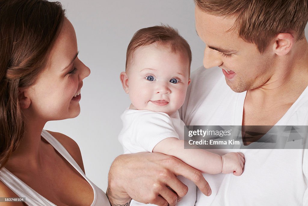 Mother and father with baby daughter