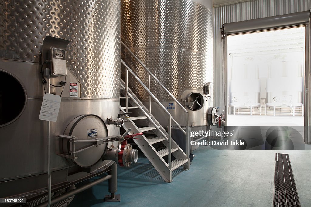 Metal vats in vineyard