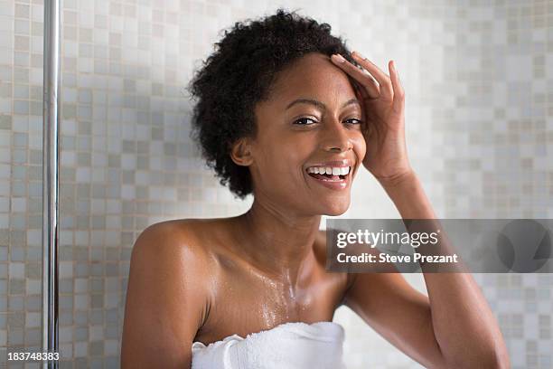 woman relaxing after bath - bath towels stock-fotos und bilder
