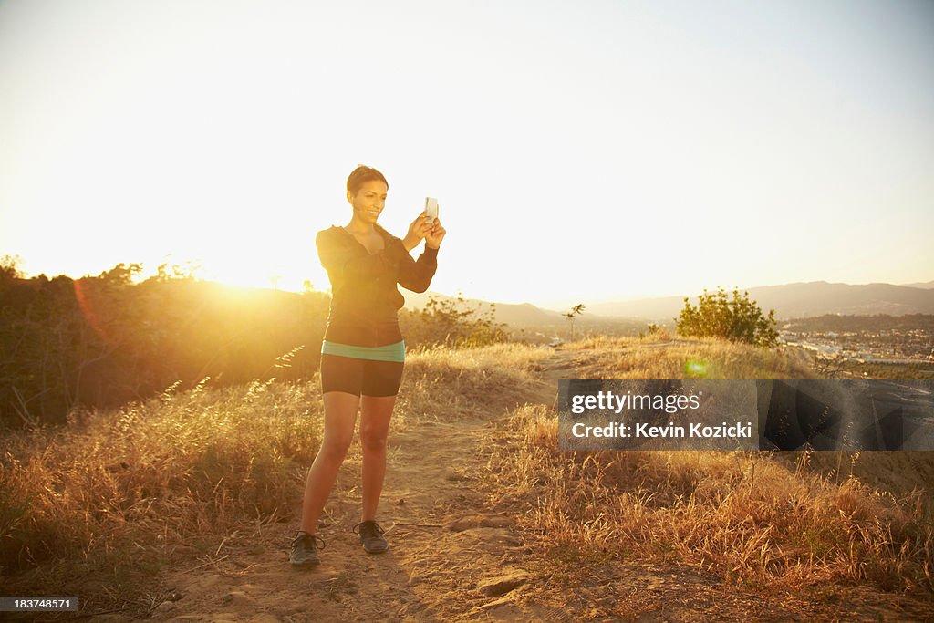 Woman photographing scenery