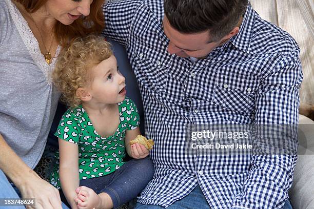 husband & wife talking to child - surrounding stock-fotos und bilder