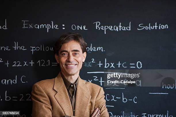 man in front of blackboard - cadalpe stock pictures, royalty-free photos & images