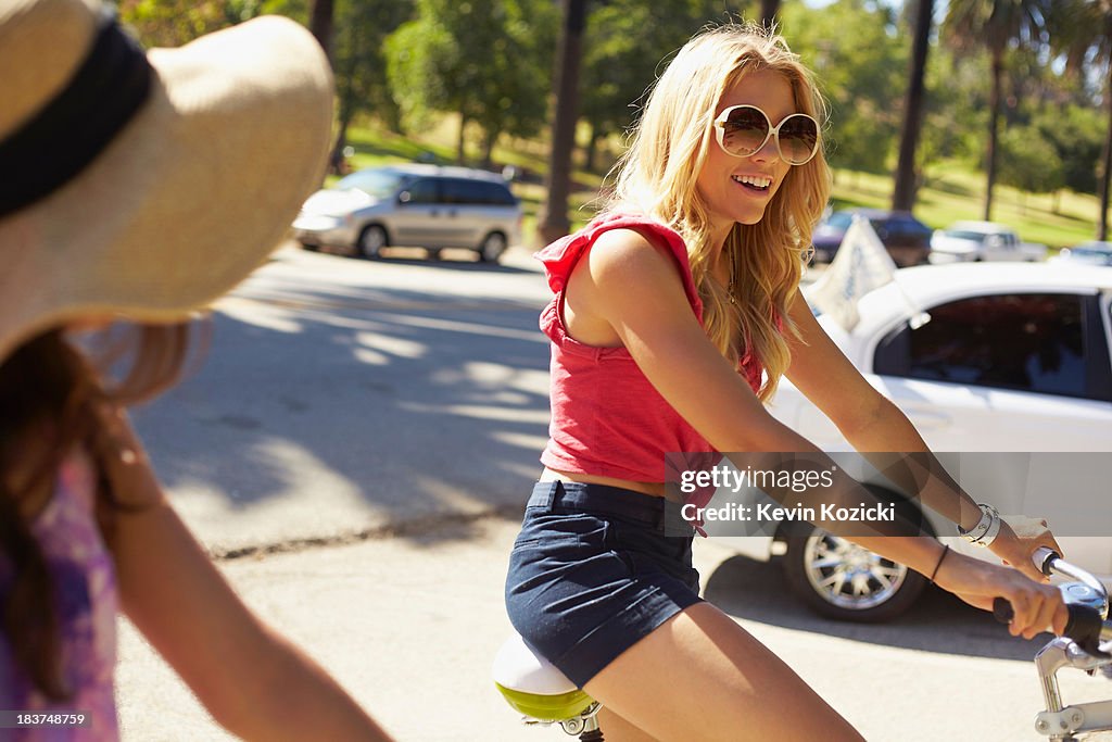 Women chatting on bicycle