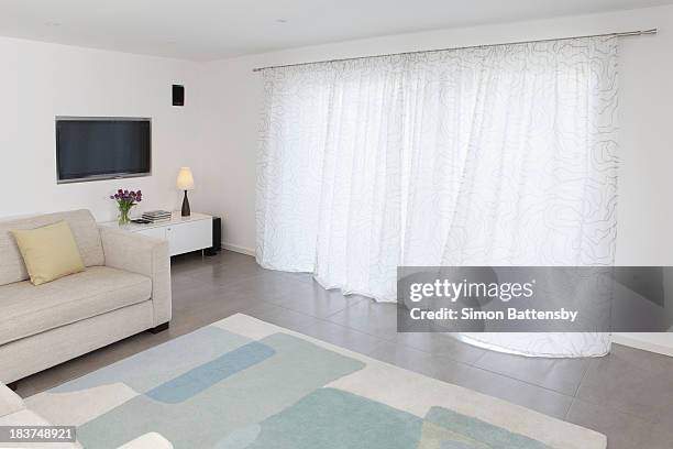 living room curtains moving slightly in the breeze - curtains blowing stock pictures, royalty-free photos & images