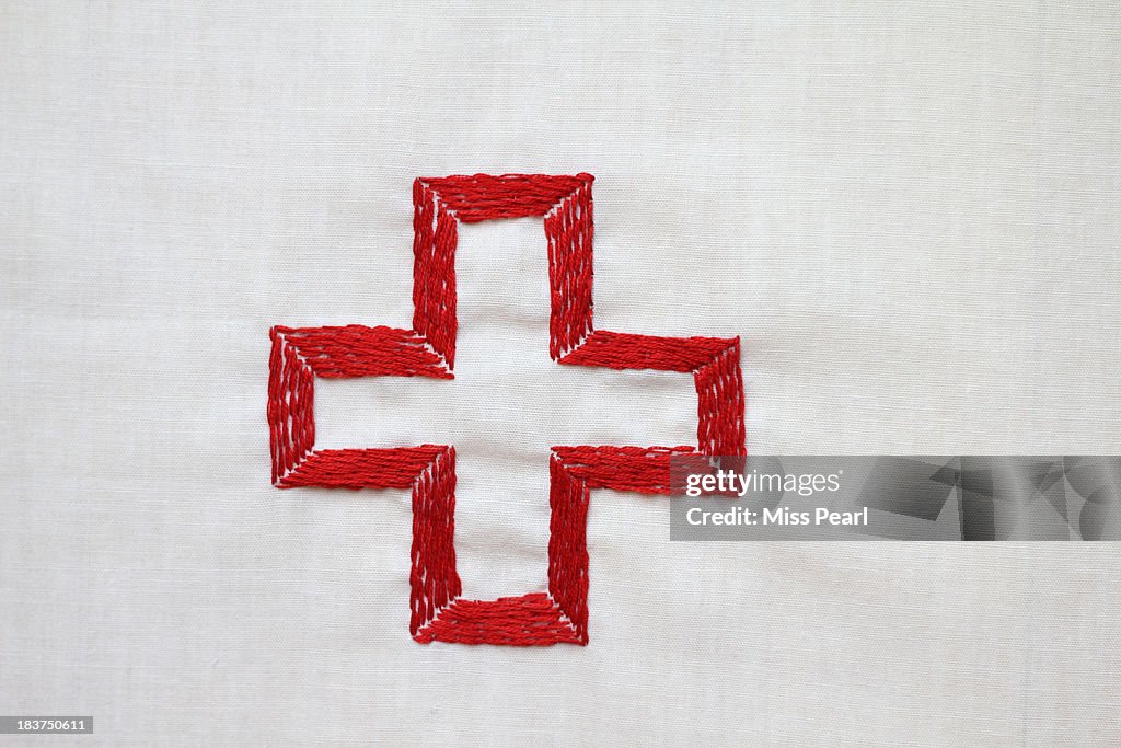 Red cross symbol embroidery illustration