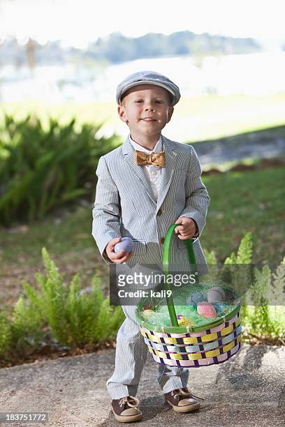 little boy in suit holding easter basket - seersucker stock pictures, royalty-free photos & images