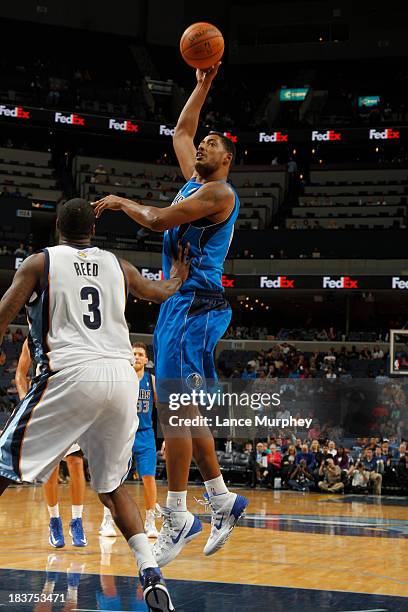 Fab Melo of the Dallas Mavericks shoots against Willie Reed of the Memphis Grizzlies during a game on October 9, 2013 at FedExForum in Memphis,...