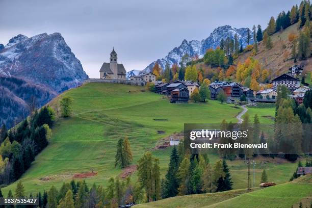 The church Chiesa Santa Lucia in Colle Santa Lucia at the foot of Giau Pass, Passo di Giau, in autumn. The entire Dolomites are part of the Unesco...