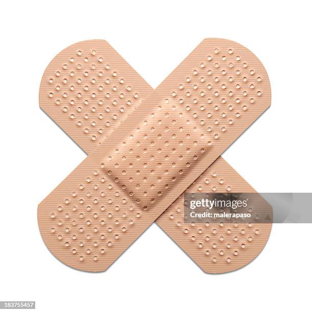 cross bandaid - medical dressings stock pictures, royalty-free photos & images