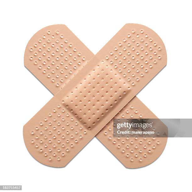 cross bandaid - first aid kit stock pictures, royalty-free photos & images