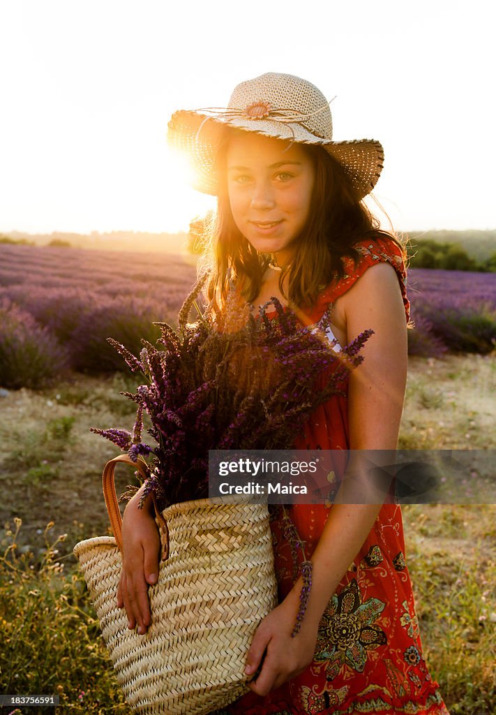 Girl holding a lavender basquet