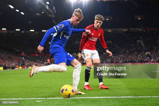 Manchester United player Alejandro Garnacho looks on as Chelsea player Cole Palmer prepares to cross the Premier League match between Manchester...