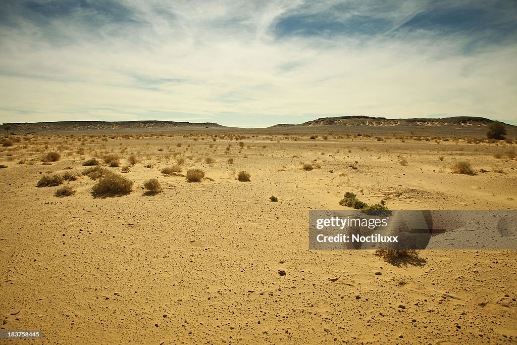 Distant mountain range in Libyan Sahara desert