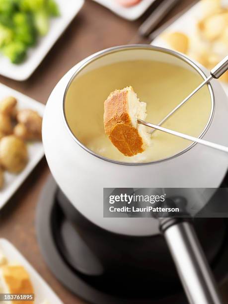cheese fondue with french bread - cheese fondue stock pictures, royalty-free photos & images