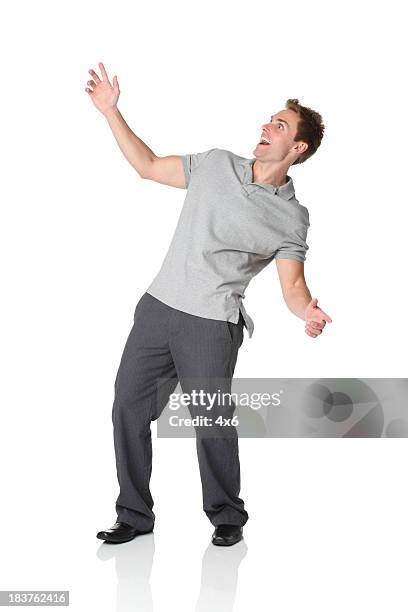 casual man leaning backwards - bending over backwards stockfoto's en -beelden