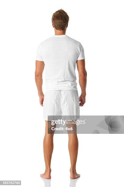 isolated man looking away standing in boxer shorts - white shorts stock pictures, royalty-free photos & images