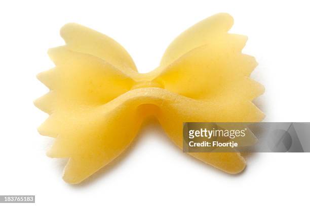 italian ingredients: farfalle isolated on white background - bow tie pasta stock pictures, royalty-free photos & images