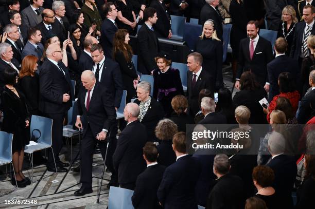 King Harald V of Norway, Queen Sonja of Norway, and Norwegian Nobel Committee chairwoman Berit Reiss-Andersen arrive to attend the 2023 Nobel Peace...