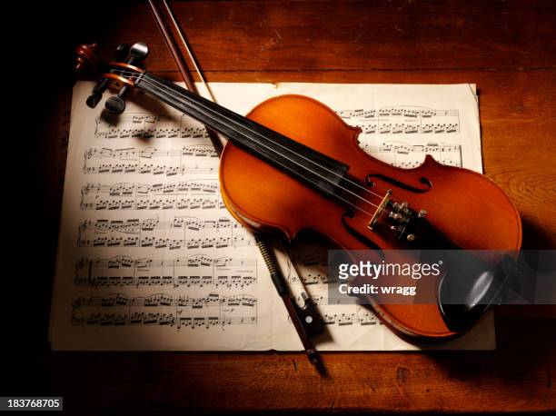 overhead view of a violin and music - mozart stock pictures, royalty-free photos & images