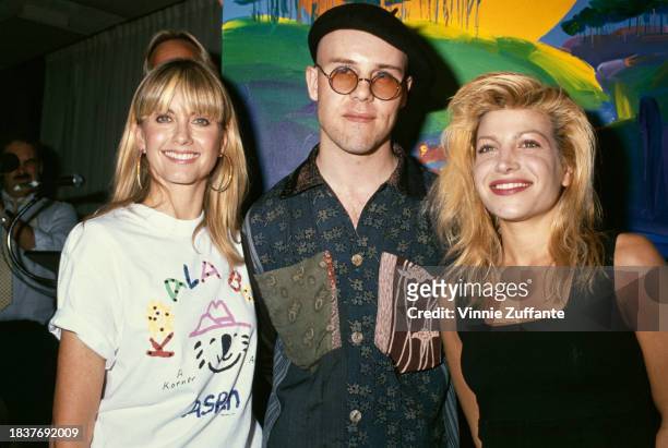 British-born Australian singer Olivia Newton-John, British musician Thomas Dolby, and American singer and songwriter Taylor Dayne attend a preview...
