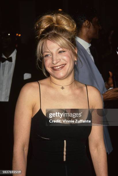 American singer and songwriter Taylor Dayne, wearing a black dress with spaghetti straps, attends the 36th Annual Grammy Awards pre-party, held at...