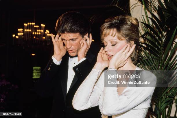 American actor Ted Danson, wearing a tuxedo and bow tie, and American actress, comedian and singer Shelley Long, who wears a white evening gown, both...
