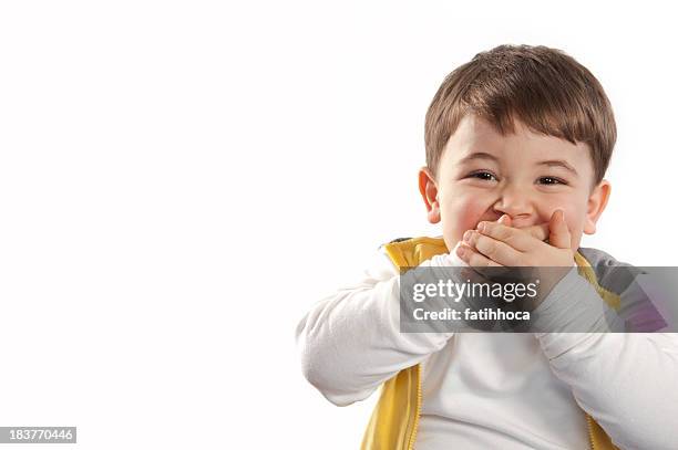 surprise child - happy with hand over mouth stock pictures, royalty-free photos & images