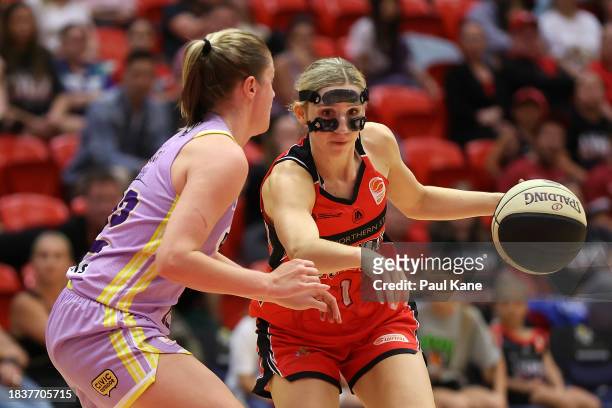 Miela Goodchild of the Lynx drives to the key against Aimie Rocci of the Boomers during the WNBL match between Perth Lynx and Melbourne Boomers at...