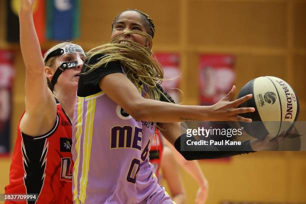 Jordin Canada of the Boomers goes to the basket during the WNBL match between Perth Lynx and Melbourne Boomers at Bendat Basketball Stadium, on...
