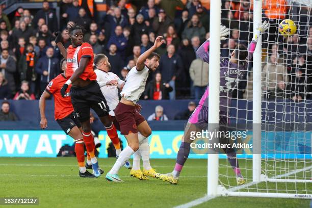 Elijah Adebayo of Luton Town scores the opening goal during the Premier League match between Luton Town and Manchester City at Kenilworth Road on...
