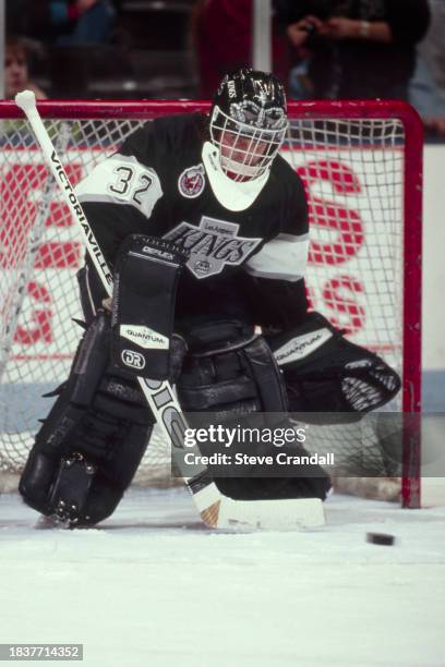 Los Angeles Kings goalie, Kelly Hrudey, prepares to make a save as the puck approaches his stick during the game against the NJ Devils at the...